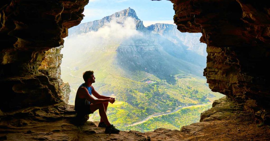 https://www.pexels.com/photo/photo-of-man-sitting-on-a-cave-1659437/
